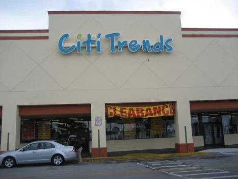 Citi Trends storefront with vehicles parked outside the entrance