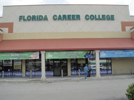 Florida Career College storefront entrance with an awning and window graphics