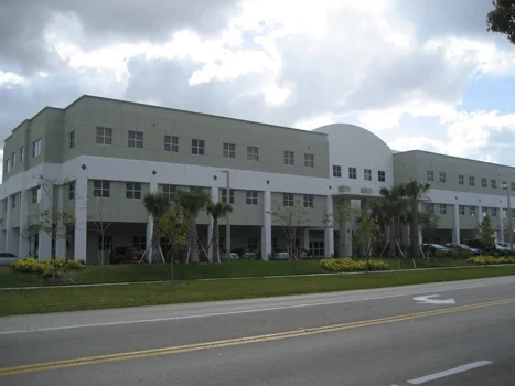 Medical building exterior with tall entrance columns viewed from the street