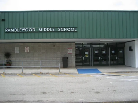 Ramblewood Middle School entrance beneath a green canopy
