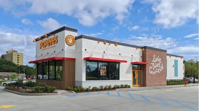 Popeyes Louisiana Kitchen exterior with a drive-through lane