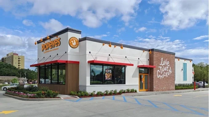 Popeyes Louisiana Kitchen exterior with a drive-through lane